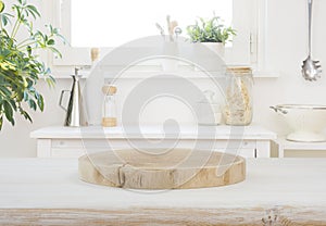 Wooden stand on table in kitchen interior and free space