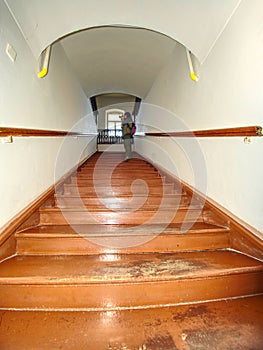 Wooden  starirs with handrail in the attic in a rustic interior photo