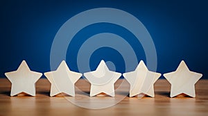 Wooden stars shape five stars rating service concept. satisfaction evaluation survey