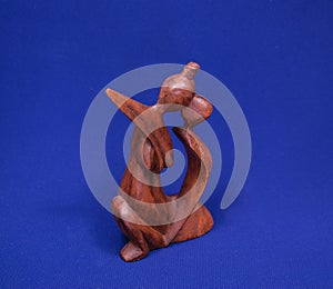 Wooden statue on a blue background