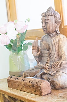 Wooden Statue of Buddha and .incense