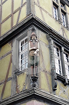 Wooden statue at a house in Colmar, Elzas, France