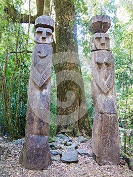 Wooden statue, in the middle of the Huilo Huilo Biological Reserve, regressing animals and Mapuche mystical characters from