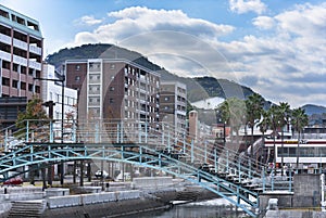 Wooden and steel made gateway called the Orandasaka Bridge crossing a channel at Nagasaki Civic Hall.