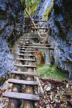 Wooden steps in gorge in mountain