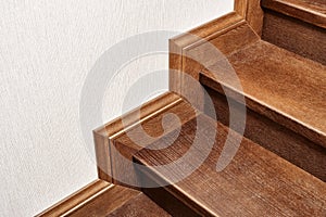 Wooden steps of indoor staircase with stair skirtboard