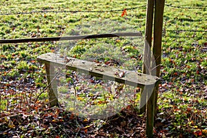 Wooden stile to help get over fence