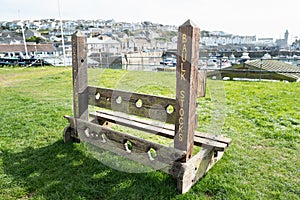 Wooden stocks in the harbour in Porthleven, Cornwall