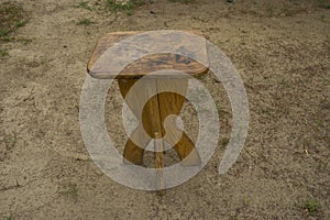 wooden stool closeup standing on ground