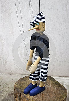 Wooden string operated puppet