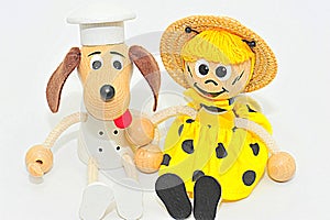 Wooden and string puppets: dog chef and bee