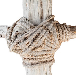 Wooden structure with a thick rope closeup isolated on whote background photo