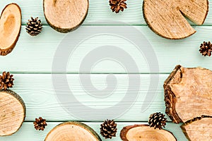 Wooden stumps and pine cones for blog background top view space for text