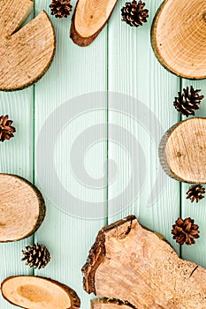 Wooden stumps and pine cones for blog background top view space for text