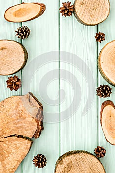 Wooden stumps and pine cones for blog background top view space for text