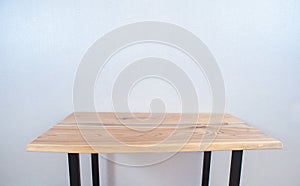 Wooden stylish table made of solid wood with epoxy resin on the background of the floor and wall. copy space