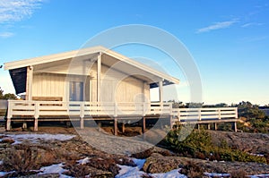 Wooden summer cottage with terrace