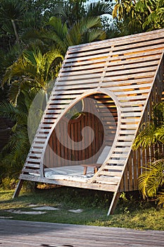 Wooden summer day bed couch for relaxing in a luxury resort