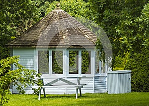 Wooden summer house in a garden