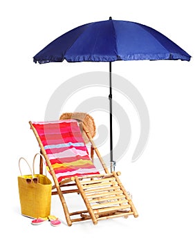 Wooden sunbed with beach accessories on white
