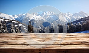 Wooden surface foreground with a magical winter landscape background snow covered pine trees and majestic snow capped mountains