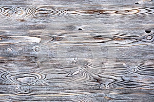 Wooden surface made of boards with a pronounced texture.