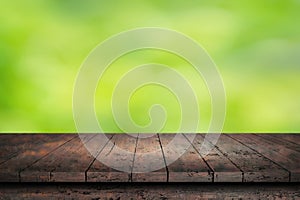 Wooden surface. Painted boards. Old dark table. Wooden table on natural green blurred background