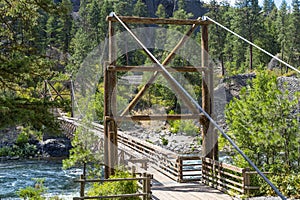 The wooden suspension bridge over the Spokane River at Riverside Park, Spokane Washington USA