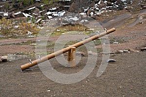 Wooden swing-balancers for children in the national park.