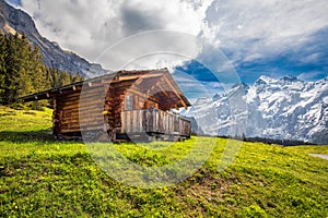 Wooden Swiss chalet in Swiss Alps near Kandersteg and Oeschinnensee, Switzerland, Europe.