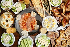 Wooden Table Adorned With Platters of Food