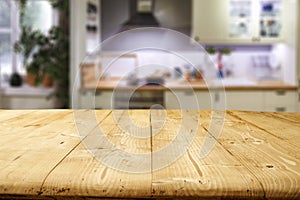 Wooden table background with free space for products, kitchen interior background.