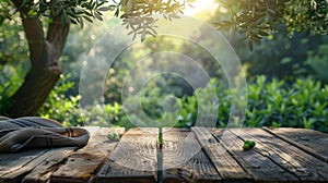 wooden table on the background of olive trees in sunlight, for advertising or presentation of goods