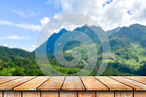 Wooden table on the beautiful mountain scenery.