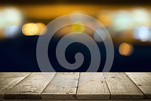 Wooden table with blur background of coffee shop