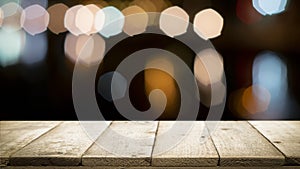 Wooden table with blur background of coffee shop