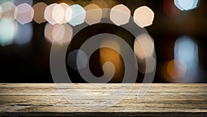 Wooden table with blur background of coffee shop