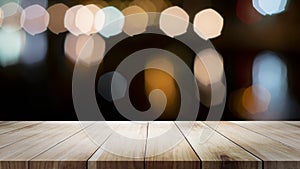 Wooden table with blur background of coffee shop