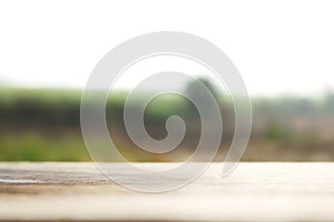 Wooden table blurred background of landscape with nature green and mountain