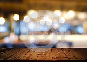 Wooden table with blurred cafe restaurant