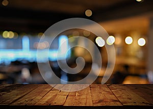 Wooden table with blurred cafe restaurant