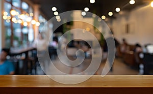 Wooden table with blurred cafe restaurant