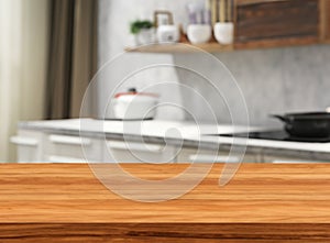 Wooden table on blurred kitchen bench background stage brown