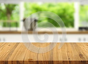 Wooden table on blurred kitchen bench background stage brown