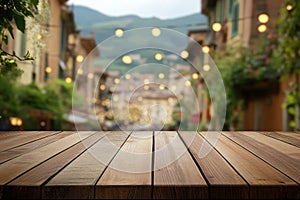 Wooden table with blurred street lights and greenery