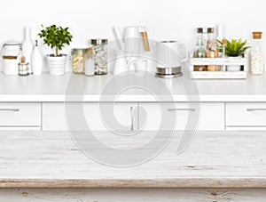 Wooden table with bokeh image of different kitchen common products