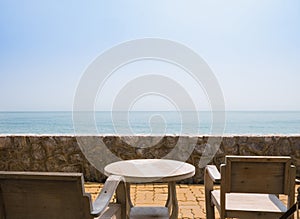 Wooden table and chair for outdoor relax by the beach
