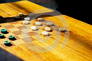 Wooden table with checkers in the games room