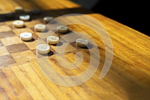 Wooden table with checkers in the games room