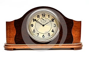 Wooden table clock on a white background